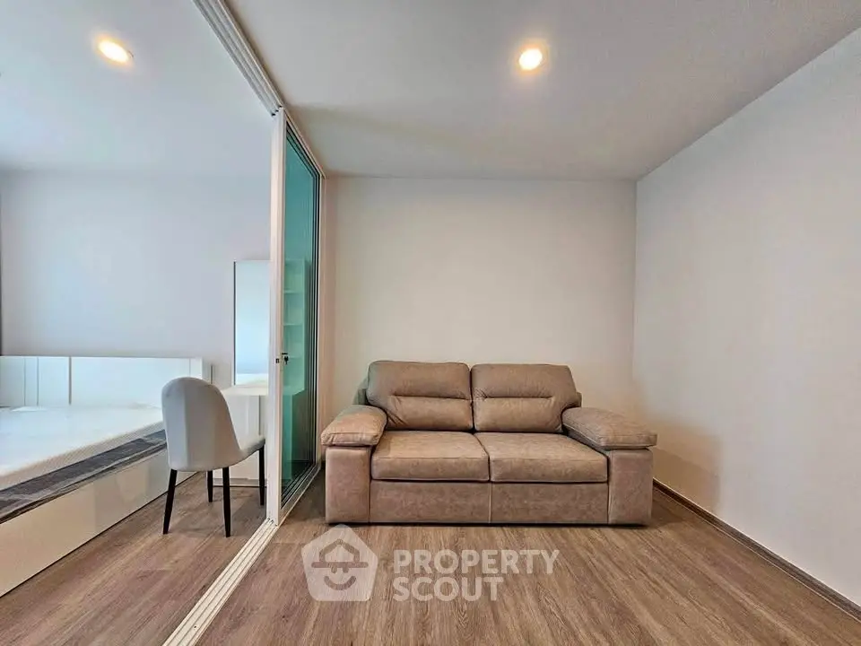 Modern living room with sleek design and cozy sofa in a stylish apartment.