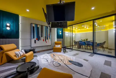 Modern living room with vibrant yellow ceiling and stylish furniture