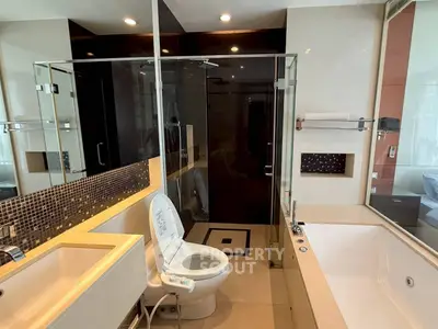 Luxurious modern bathroom with glass shower and large bathtub