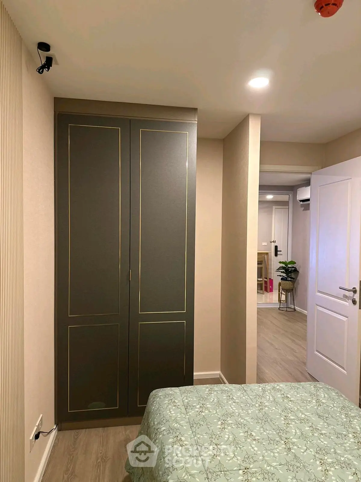 Cozy bedroom with elegant wardrobe and modern decor