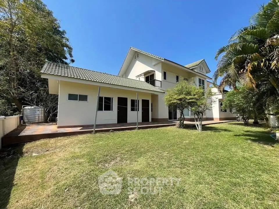 Spacious two-story house with lush garden and modern architecture
