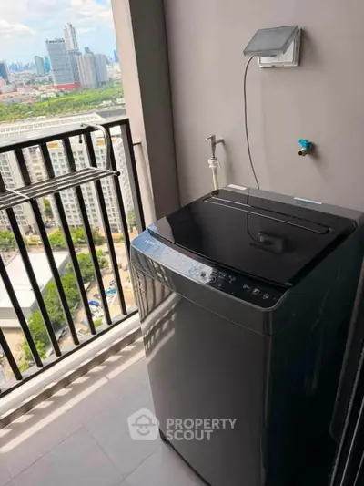 Modern balcony with washing machine and city view, perfect for urban living convenience.