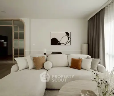 Elegant modern living room with plush white sofa and stylish decor