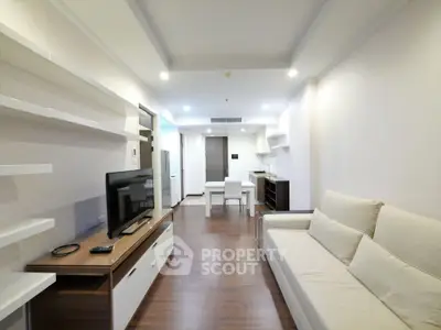 Spacious modern living room with sleek furniture and open layout, perfect for contemporary living.