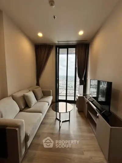 Modern living room with cozy sofa and city view from large window.