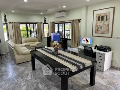 Spacious living room with modern decor and marble flooring