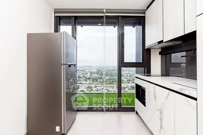 Modern kitchen with stunning city view and sleek appliances