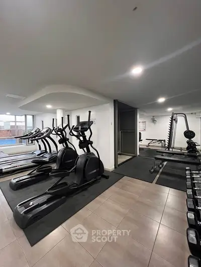 Modern gym with state-of-the-art equipment in a residential building.