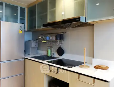 Modern kitchen with sleek appliances and ample storage space