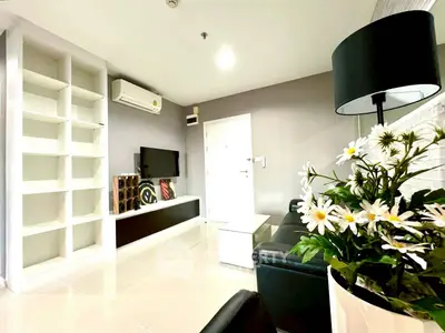 Modern living room with sleek design and built-in shelving