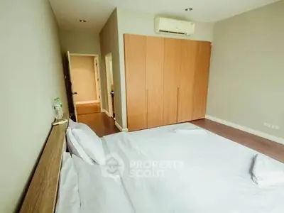 Spacious bedroom with modern design and ample storage space