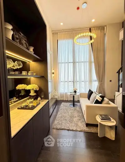 Luxurious high-ceiling living room with elegant decor and large windows