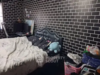 Cozy bedroom with unique brick-patterned walls and modern decor
