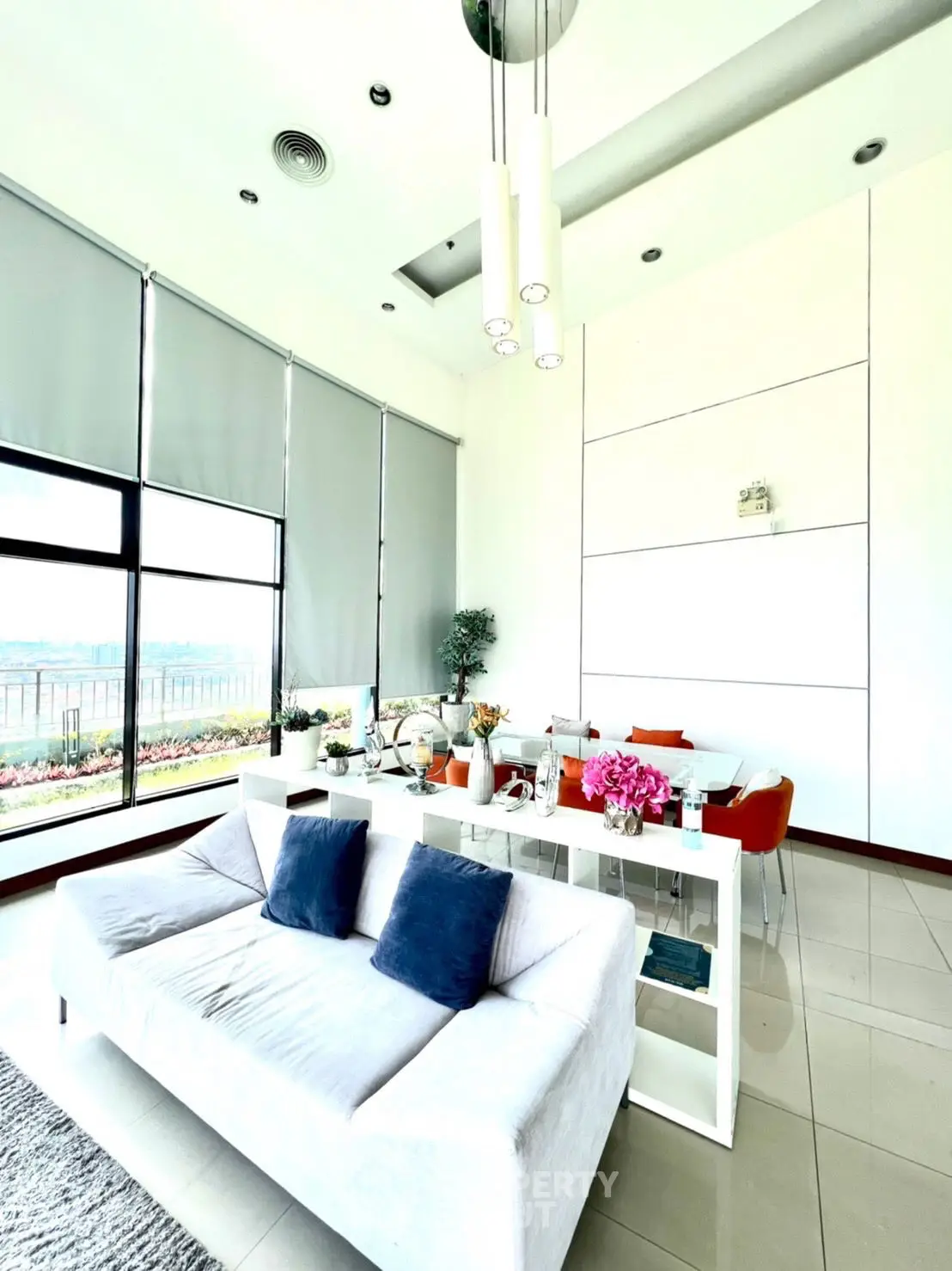 Luxurious modern living room with large windows and elegant decor