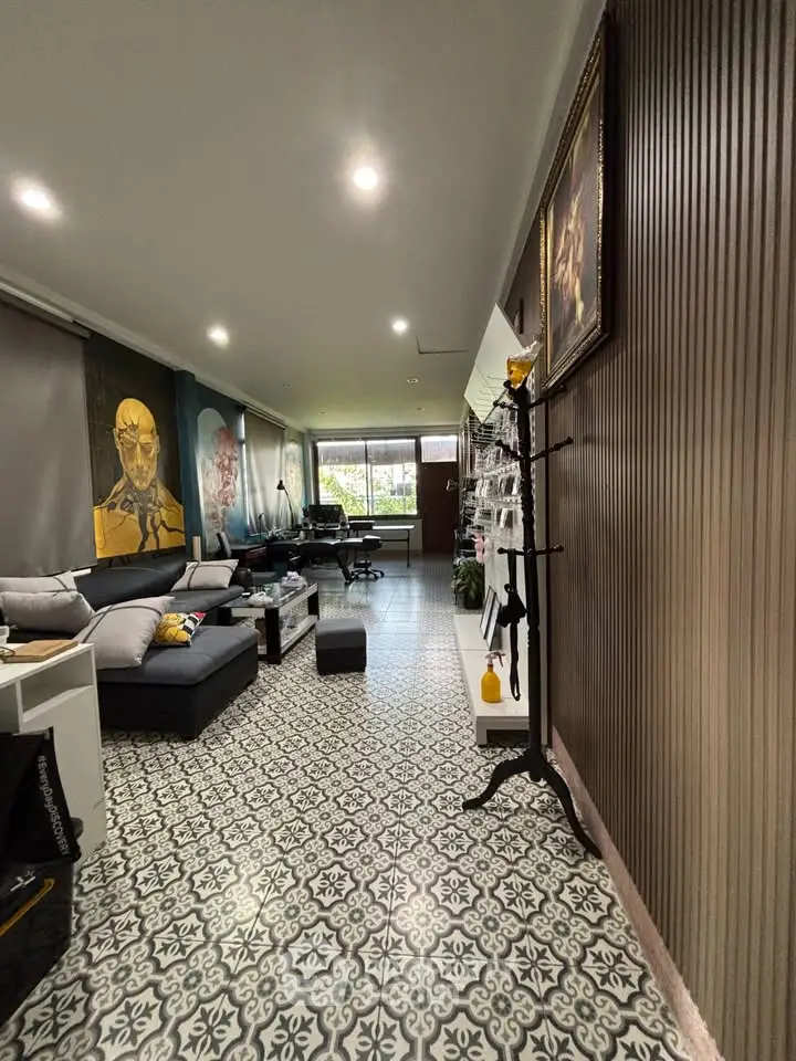 Stylish living room with patterned tile flooring and modern decor