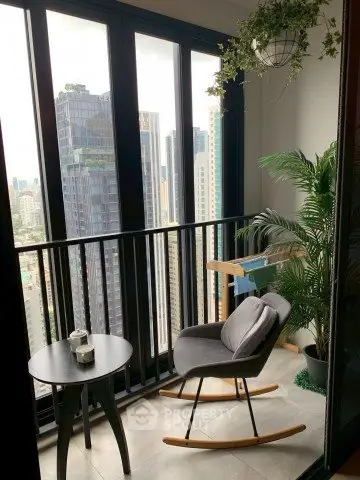 Chic urban balcony with city view, stylish rocking chair, and lush greenery for a serene retreat.