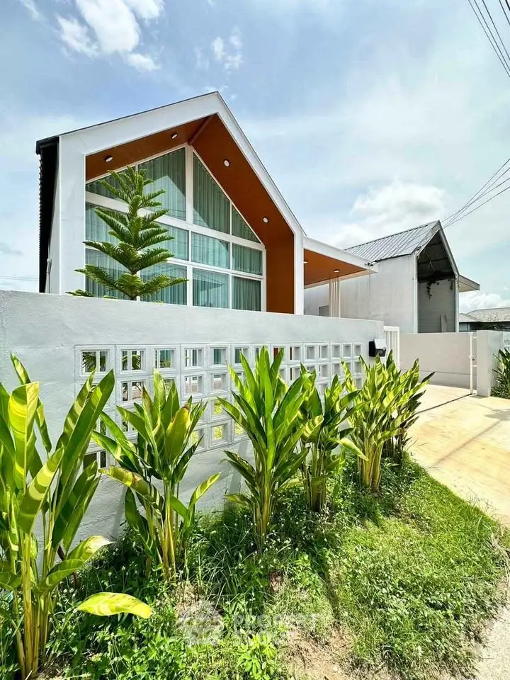 Modern architectural home with lush garden and stylish facade
