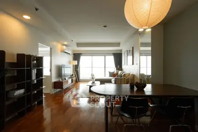 Spacious living room with modern decor and large windows for natural light.