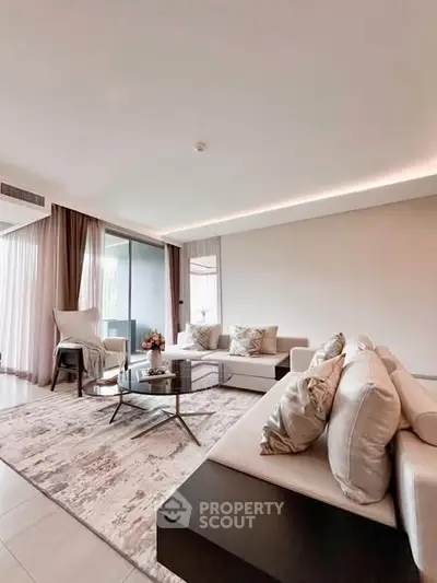 Spacious modern living room with elegant decor and large windows