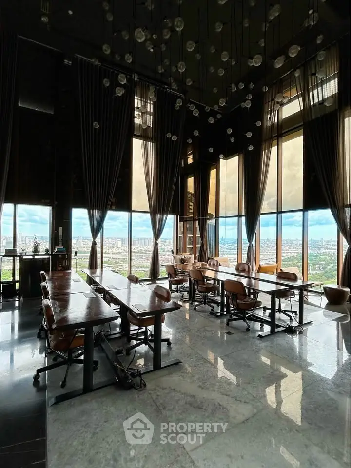 Luxurious high-rise building with panoramic city views and elegant interior design.