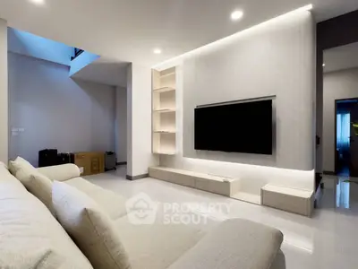 Modern living room with sleek TV setup and stylish shelving