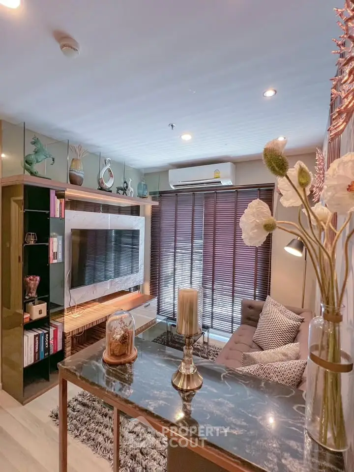 Stylish living room with modern decor, cozy seating, and elegant lighting in a contemporary apartment.