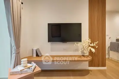 Modern living room with wall-mounted TV and stylish wooden decor