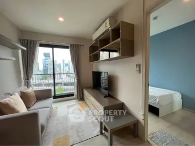 Modern living room with city view, stylish furniture, and adjacent bedroom in a high-rise apartment.