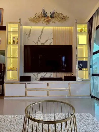 Luxurious living room with modern TV unit and elegant decor
