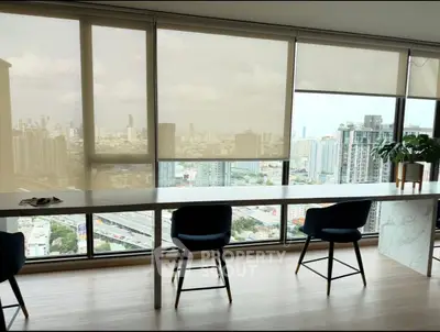 Stunning high-rise apartment with panoramic city views and modern interior design.
