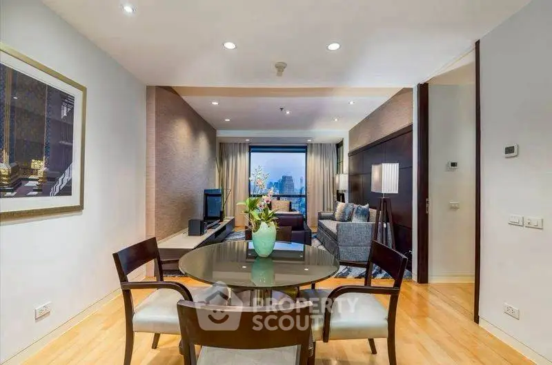 Elegant living room with modern decor and city view, featuring a stylish dining area.