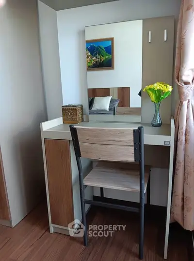 Charming bedroom corner with a stylish vanity desk and chair, perfect for a cozy and functional space.