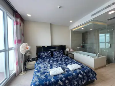 Luxurious bedroom with modern ensuite bathroom and large windows
