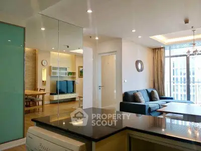 Modern open-plan living room with stylish decor and natural light