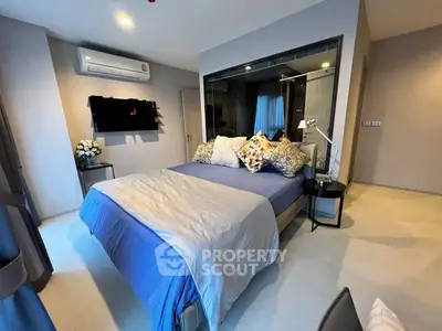 Modern bedroom with stylish decor and air conditioning in a cozy apartment.