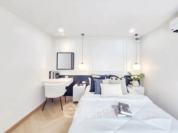 Modern minimalist bedroom with cozy decor and elegant lighting