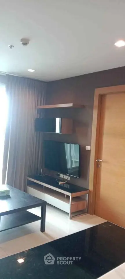 Modern living room with sleek TV setup and stylish decor