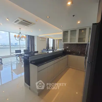 Spacious open-layout kitchen with modern appliances and stunning city view