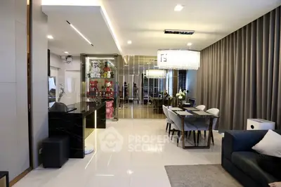 Luxurious open-plan living and dining area with modern decor and elegant lighting