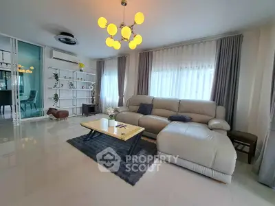 Spacious modern living room with elegant lighting and plush sofa