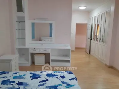 Spacious bedroom with built-in wardrobe and stylish decor