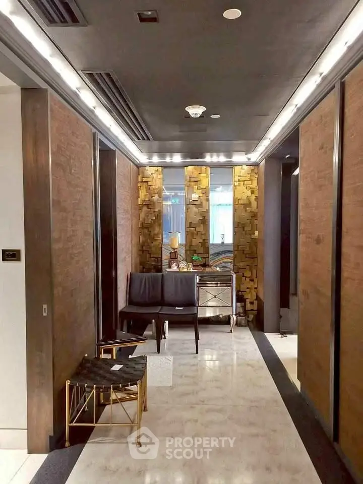 Luxurious building entrance with modern seating and elegant decor