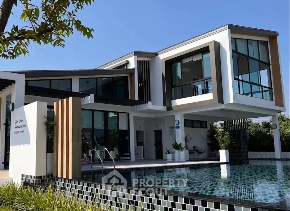 Stunning modern villa with sleek architecture and luxurious poolside view, perfect for upscale living.