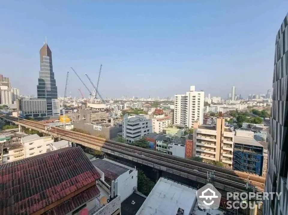 Stunning urban cityscape view with modern skyscrapers and railway, perfect for real estate investment.