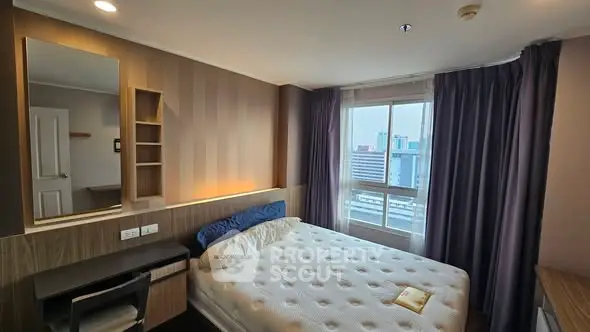 Modern bedroom with city view, featuring a cozy bed and stylish decor.