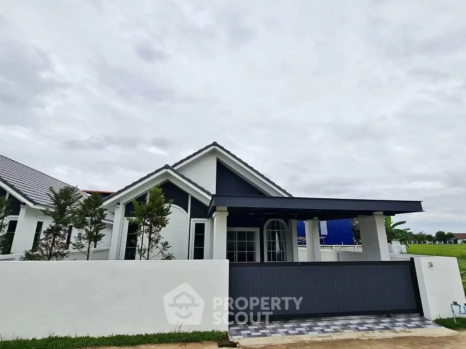 Charming modern house with sleek design and spacious driveway in a serene neighborhood.