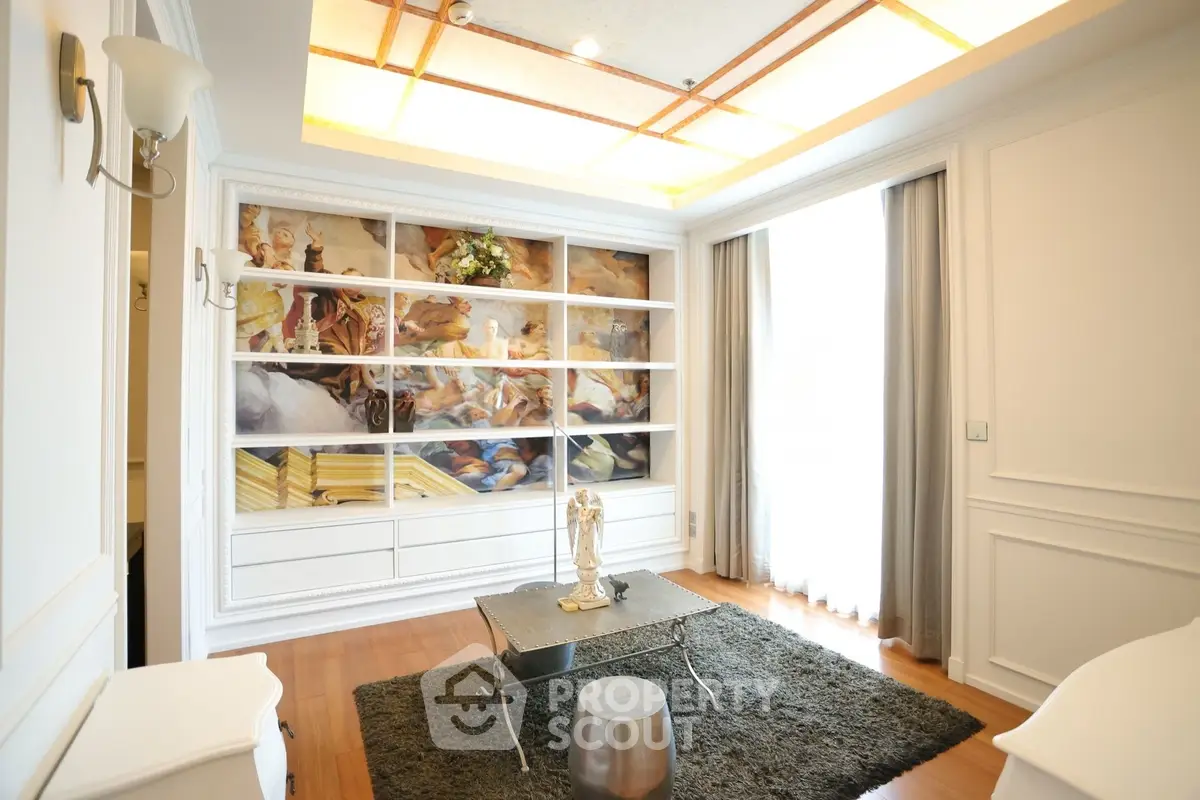 Elegant living room with artistic wall decor and modern furnishings