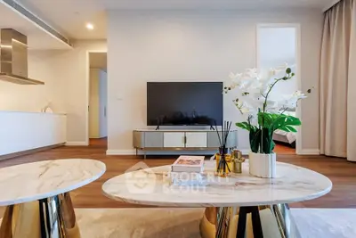 Luxurious modern living room with elegant decor and sleek TV setup