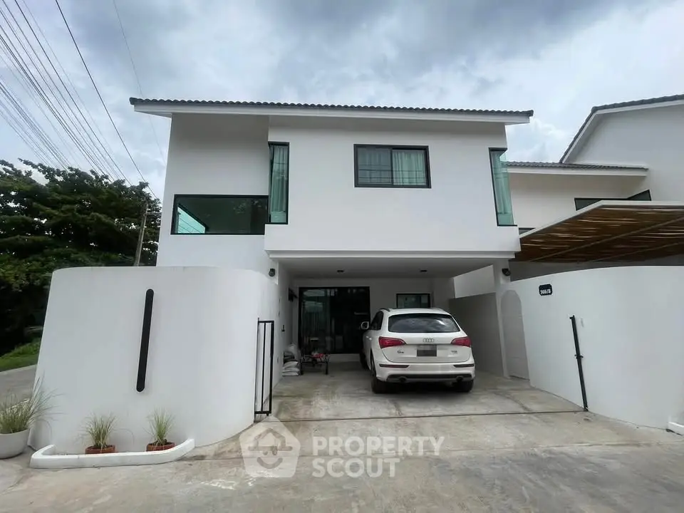Modern two-story white house with carport and sleek design