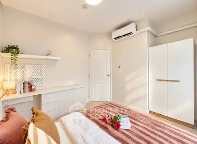 Cozy bedroom with modern decor and air conditioning unit